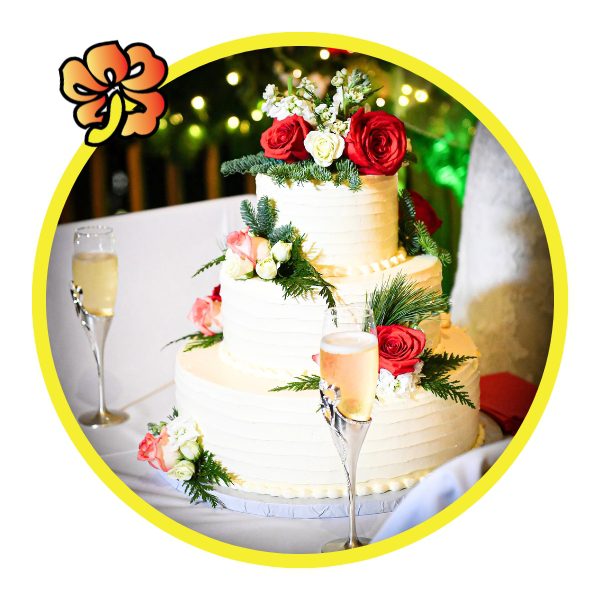 A wedding cake with flowers on top of it.